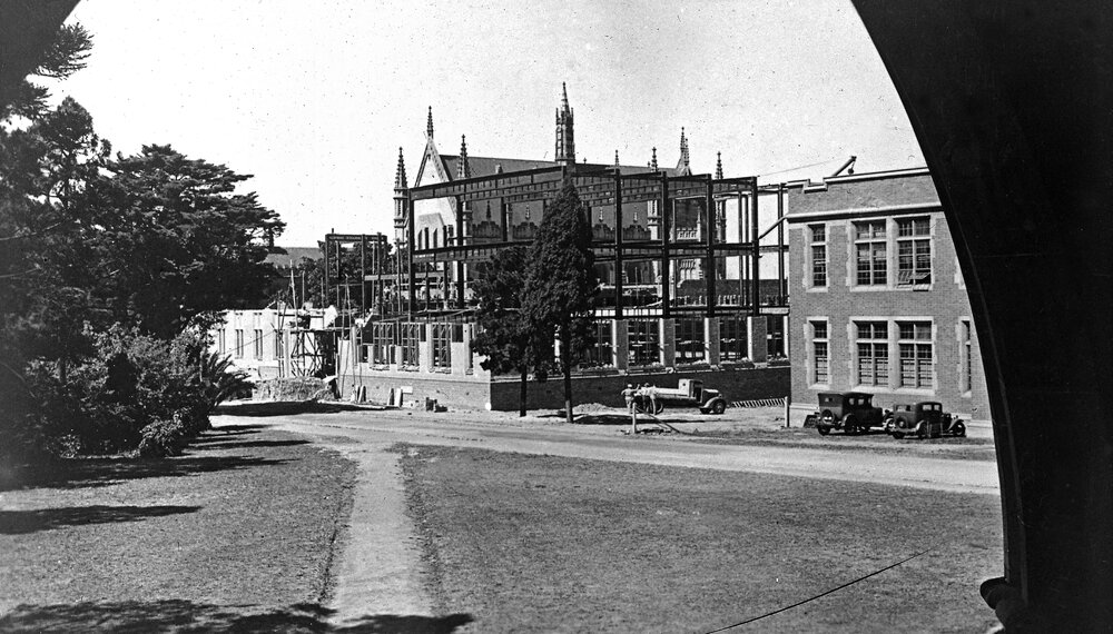 University building under construction. Wilson Hall in the distance.