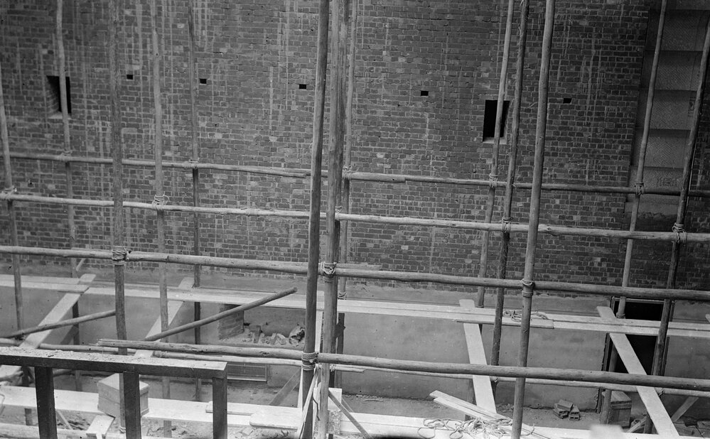 University building under construction.  South wall of Masson Theatre.
