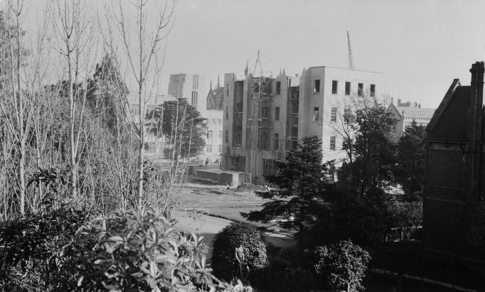 University building under construction.  Commerce from top of old Cuming Theatre.