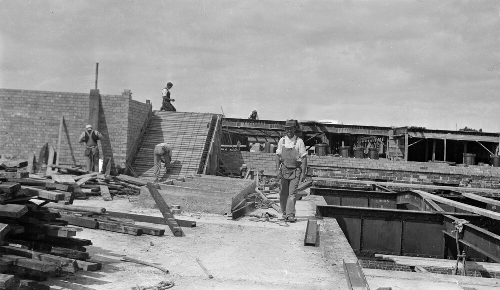 University building under construction. Base of tower, stairs, Masson skylight and windows to Org lab.