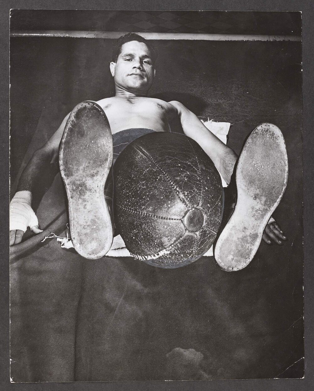 Jack Hassen doing ground exercises with a medicine ball