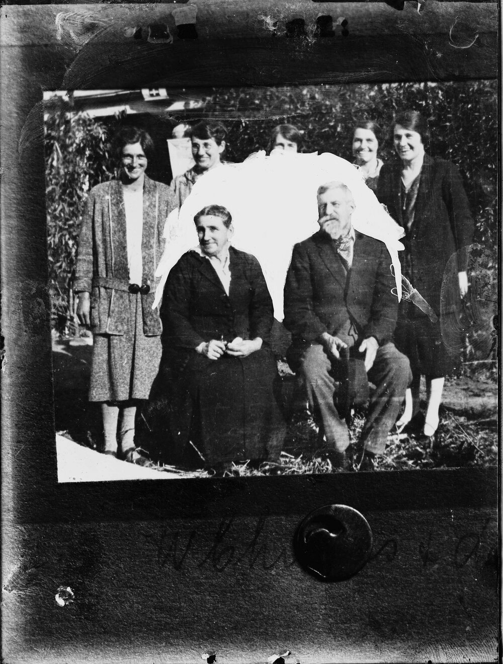 Group of six women surrounding a man.
