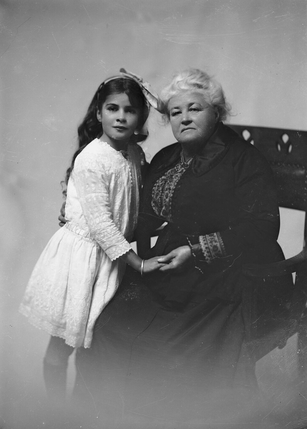 Portrait of an unidentified elderly woman and a girl.