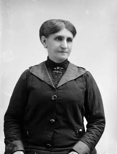 Studio half-length portrait of a woman.