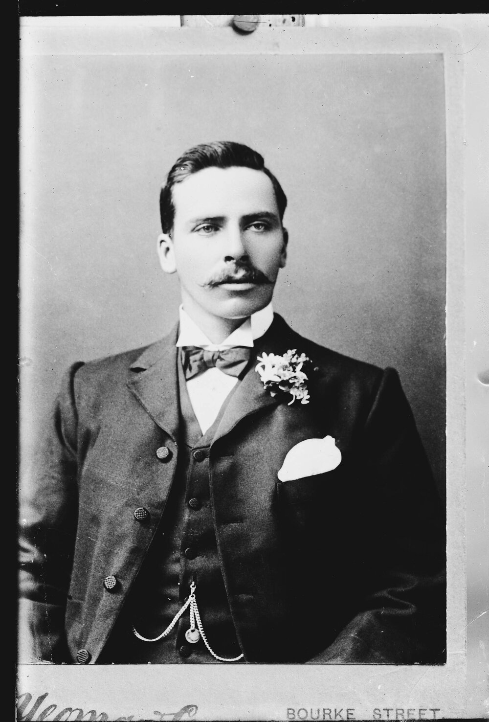 Studio portrait of an unidentified young man wearing a bow tie.