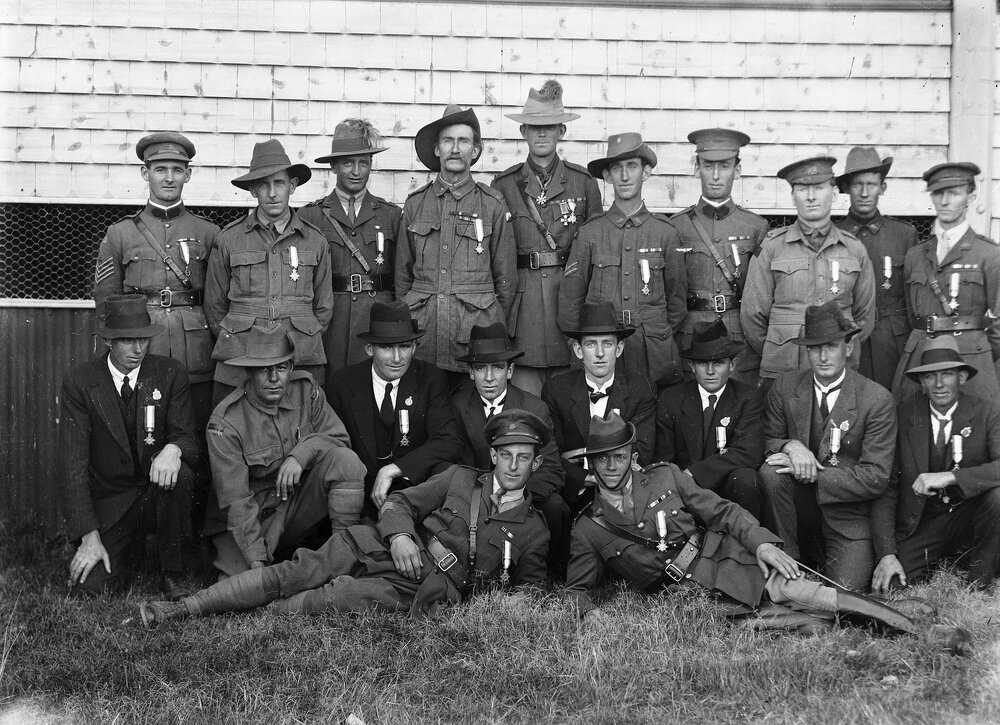 A group of men, some wearing Australian Army uniforms.