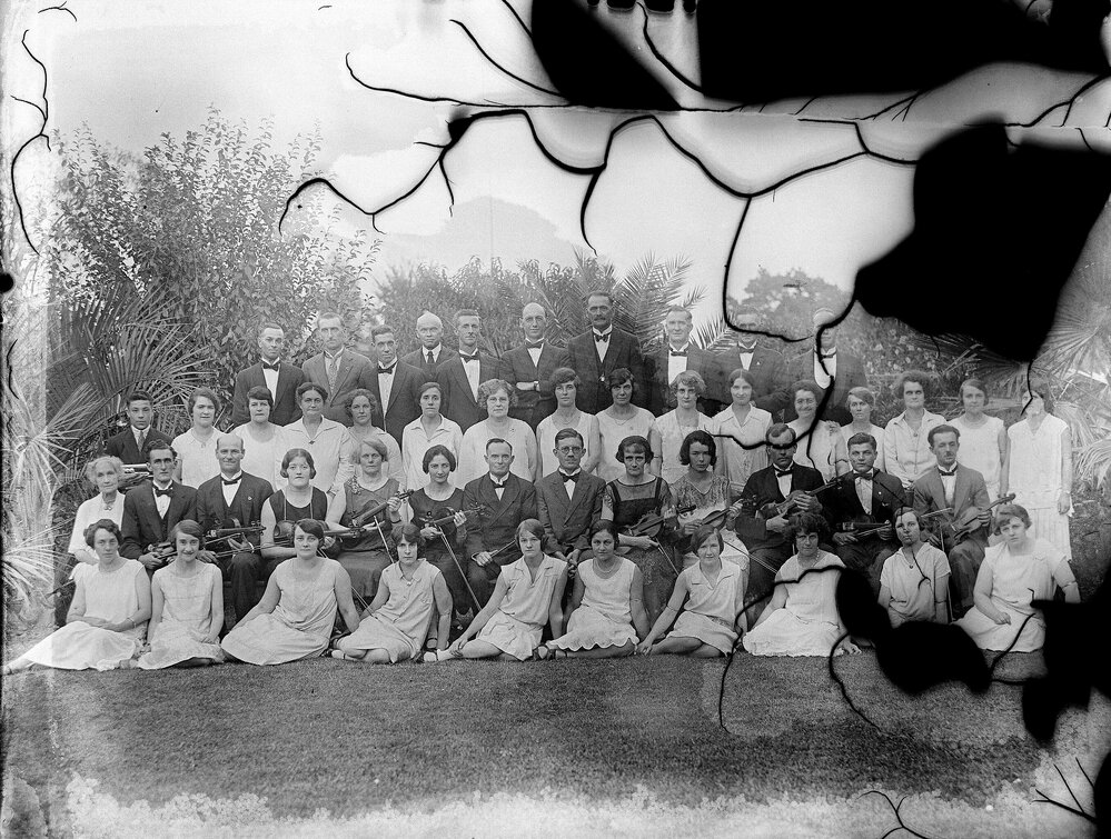 A posed group of musical performers, either the Benalla Musical Society or Mona Rahilly Orchestra.