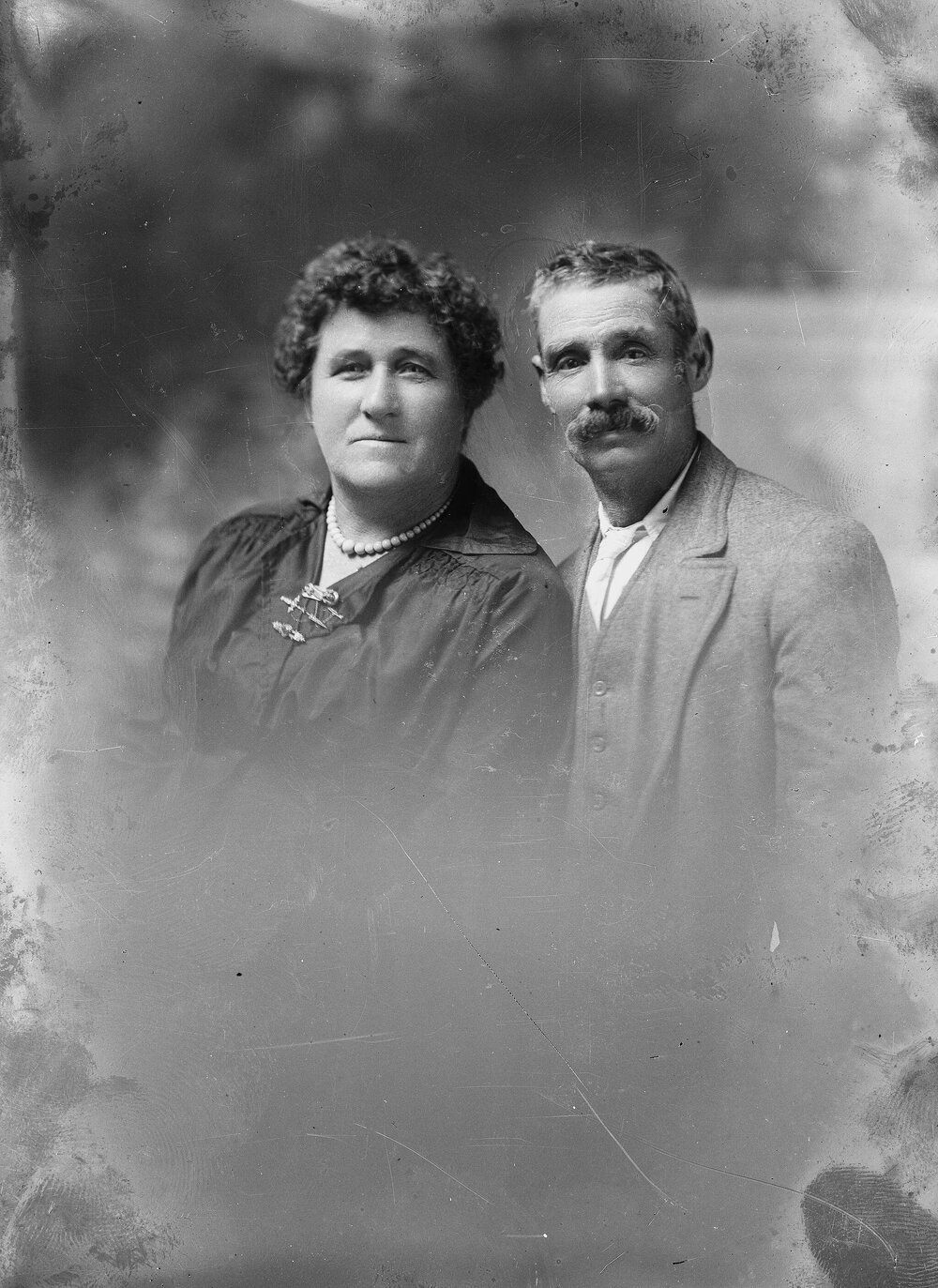 Studio portrait of an unidentified woman and man.