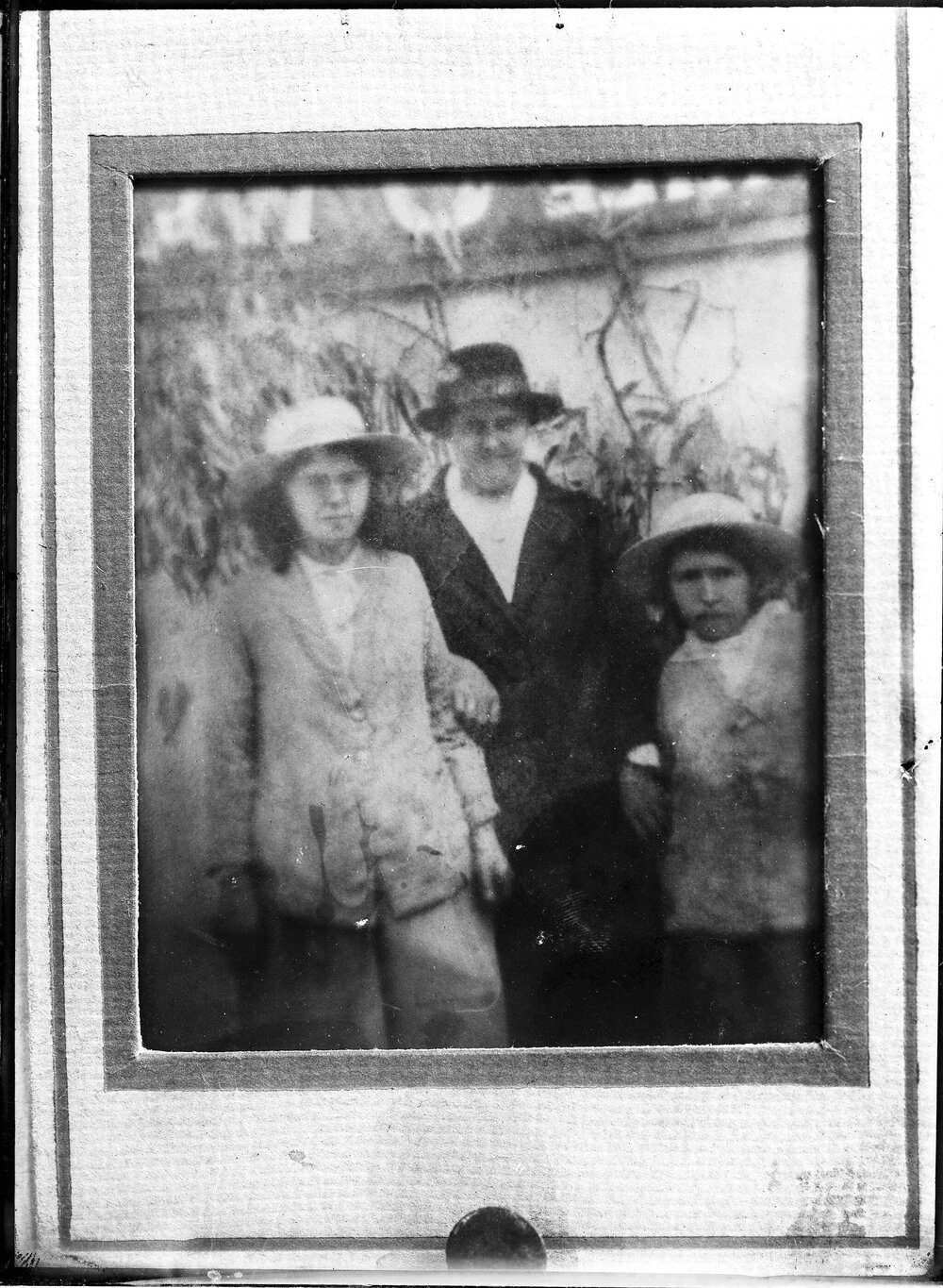 An unidentified group of three females in an outdoor setting.