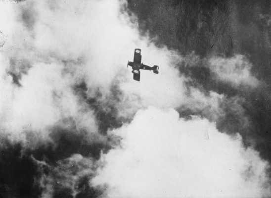 An R.A.A.F. bi-plane aircraft in flight.