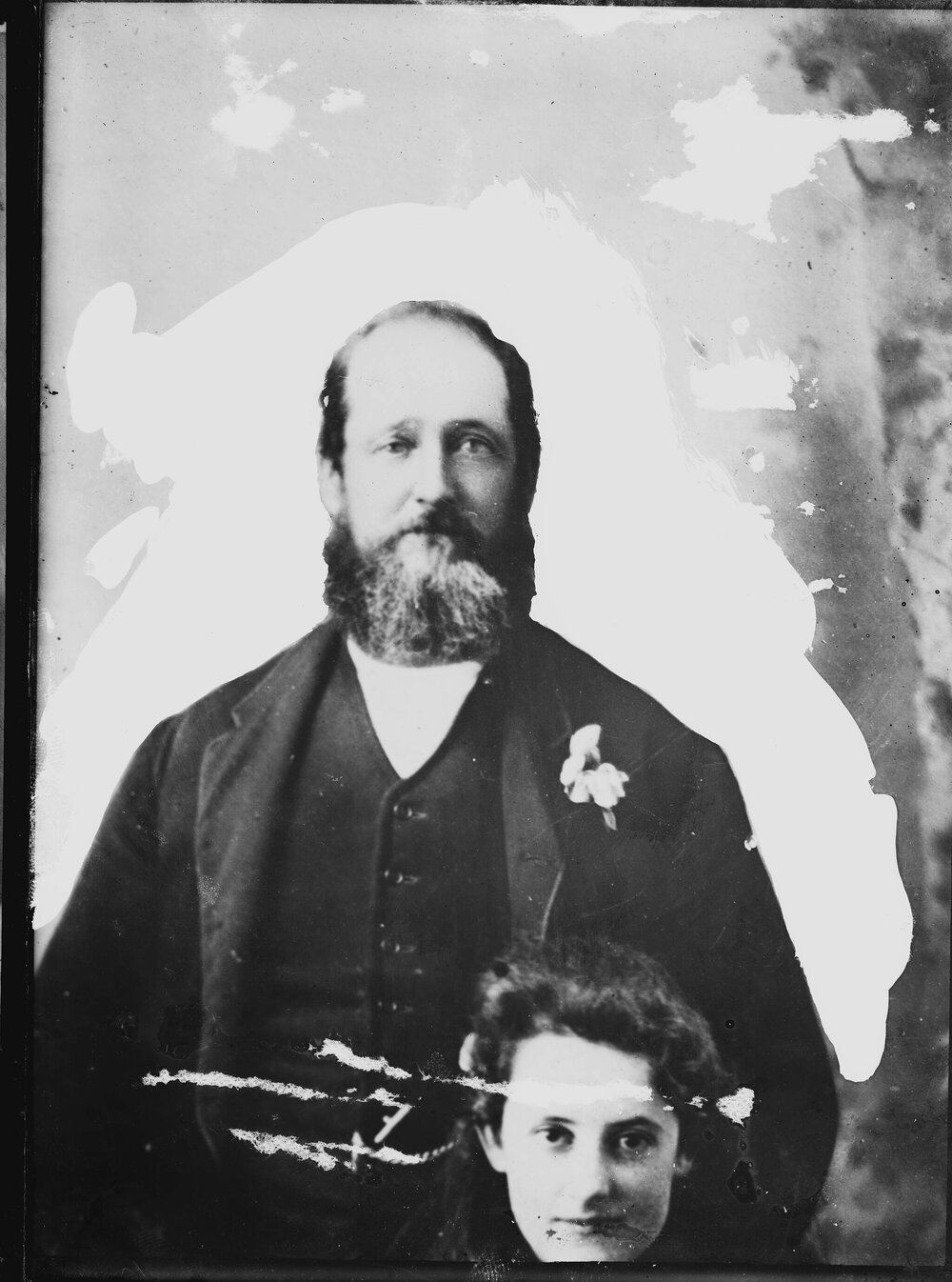 An unidentified man dressed in a suit.