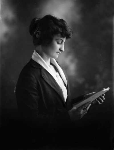 Studio portrait of Miss B. O&rsquo;Brien reading a book.