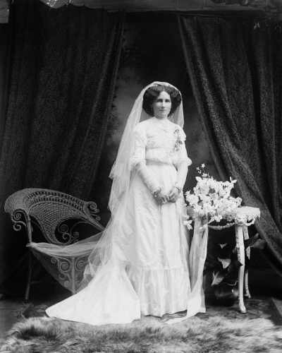 Studio portrait of Mrs. Jennings dressed as a bride.