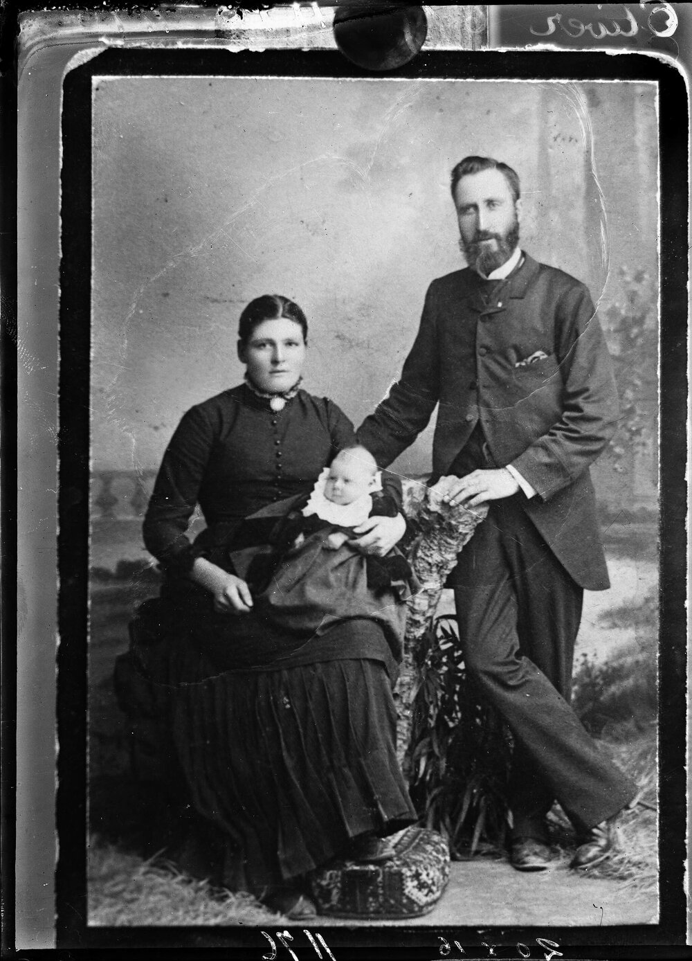 Studio portrait of a man,  woman and a  baby.