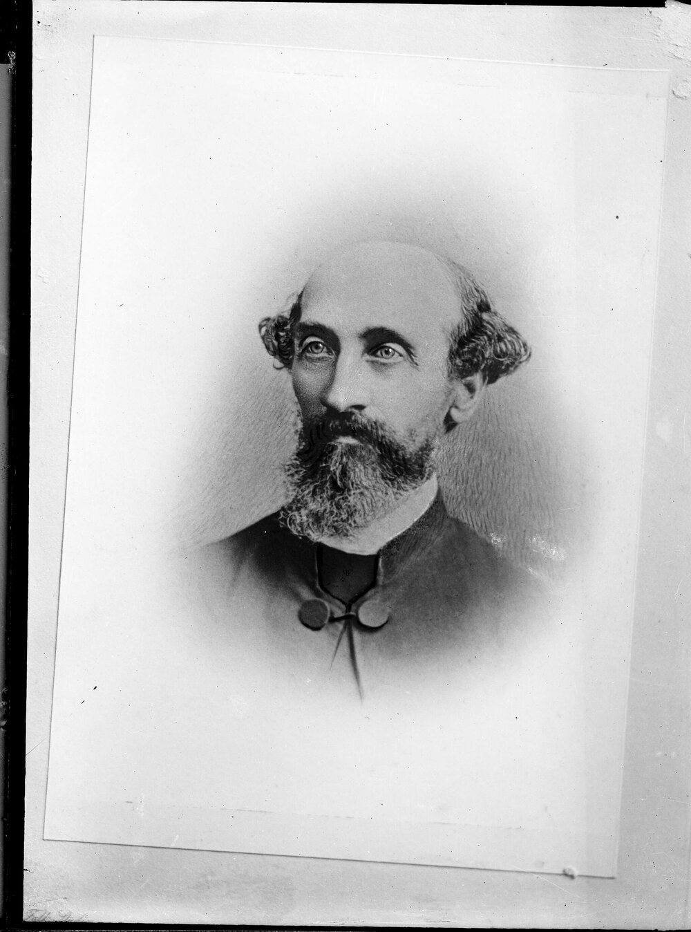 Portrait of an unidentified balding and bearded man.