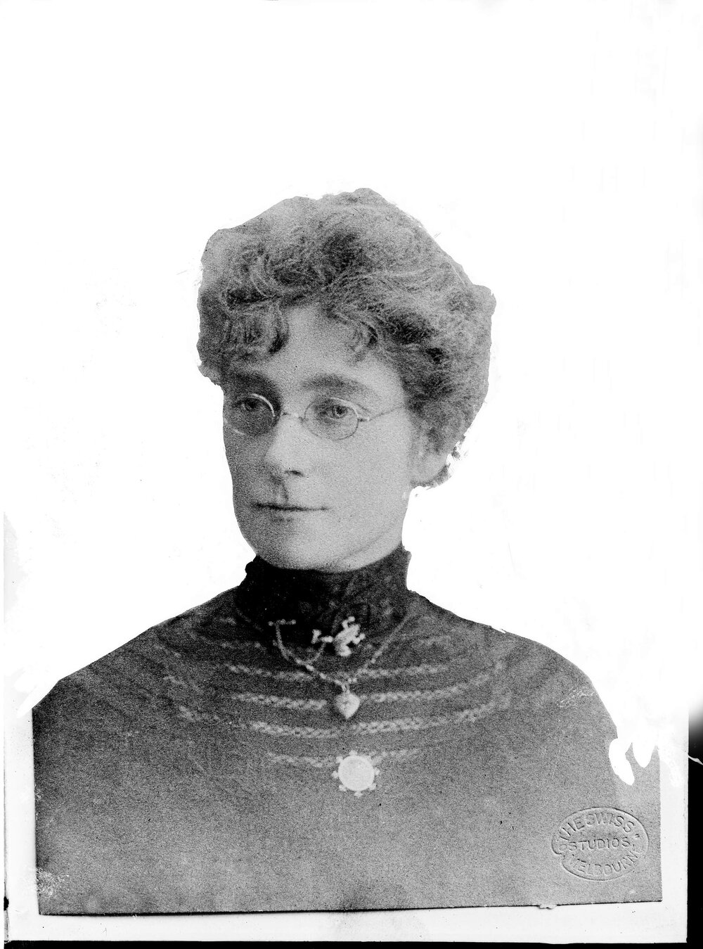 Portrait of an unidentified woman wearing a frog brooch.
