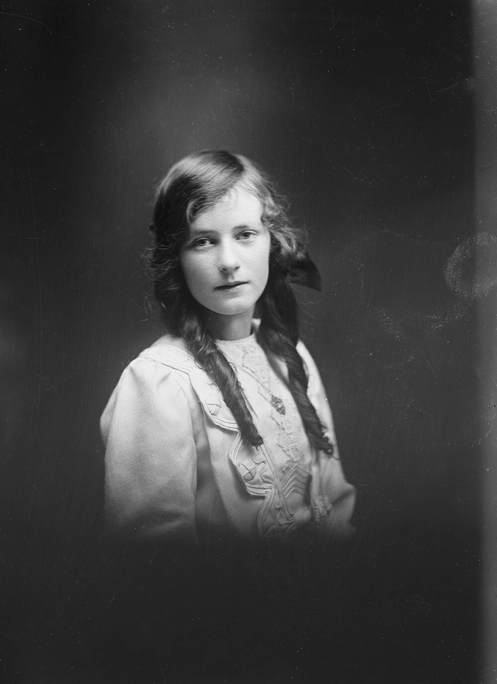 Studio portrait of an unidentified girl with long hair.