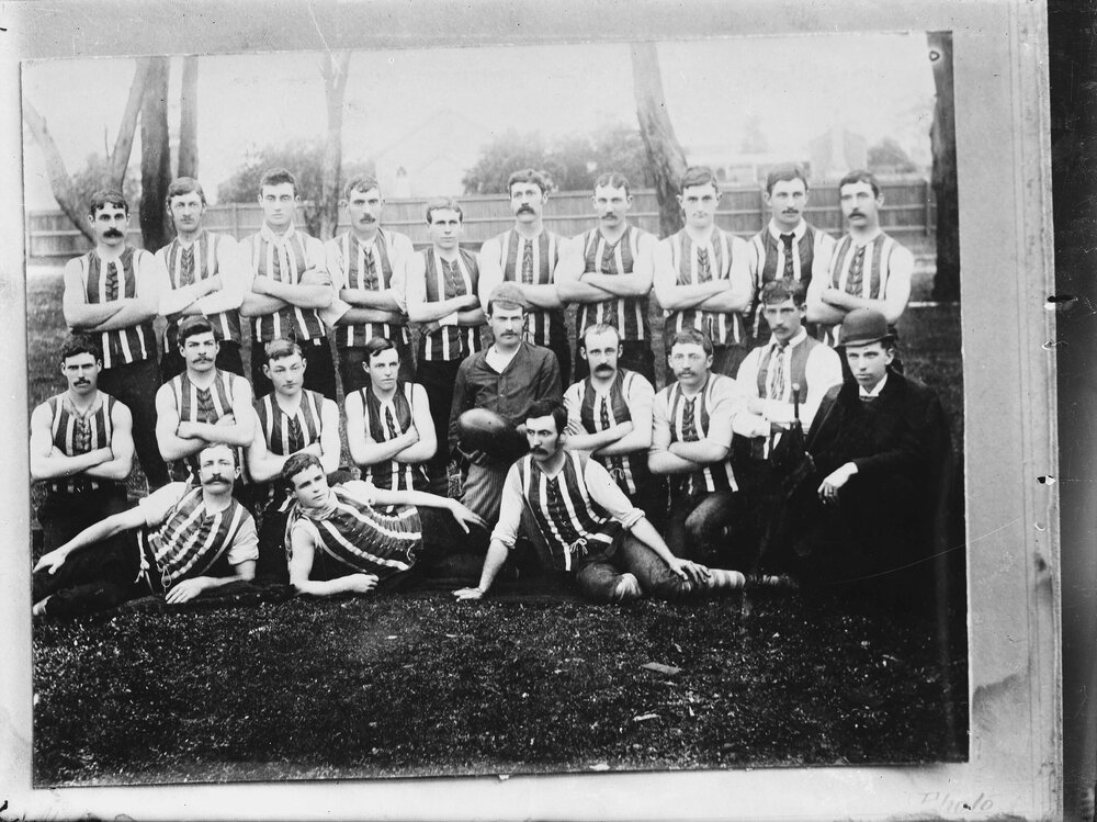 A posed group of football players.