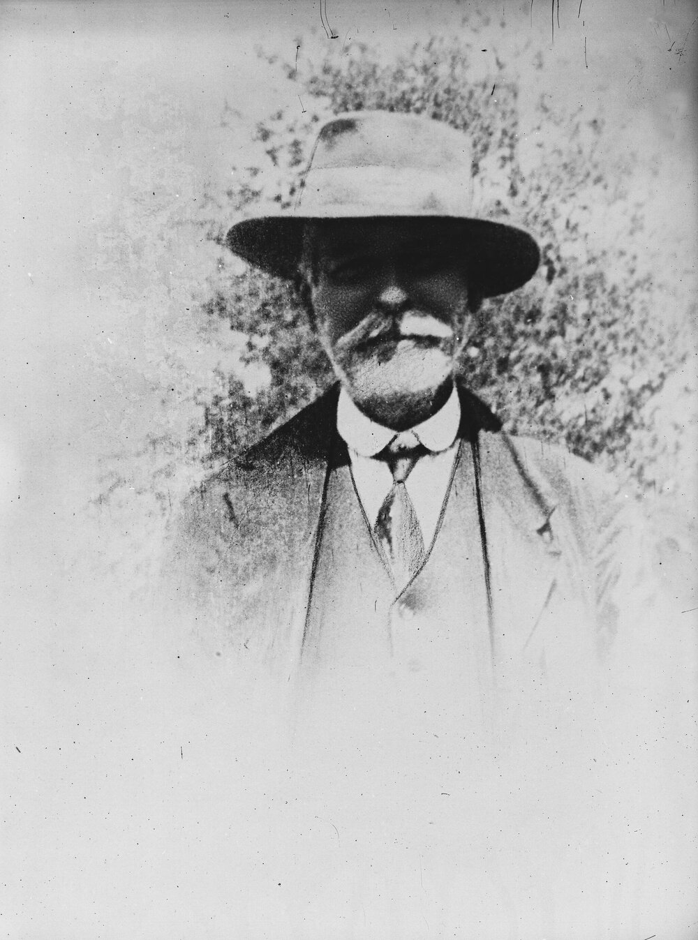 Portrait of an unidentified man wearing a hat.