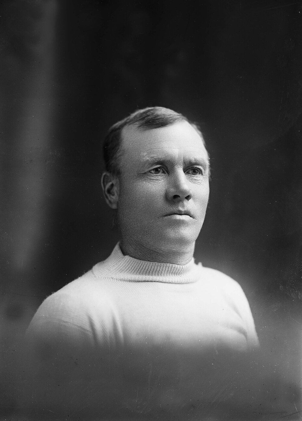 Portrait of an unidentified man wearing a white vest.