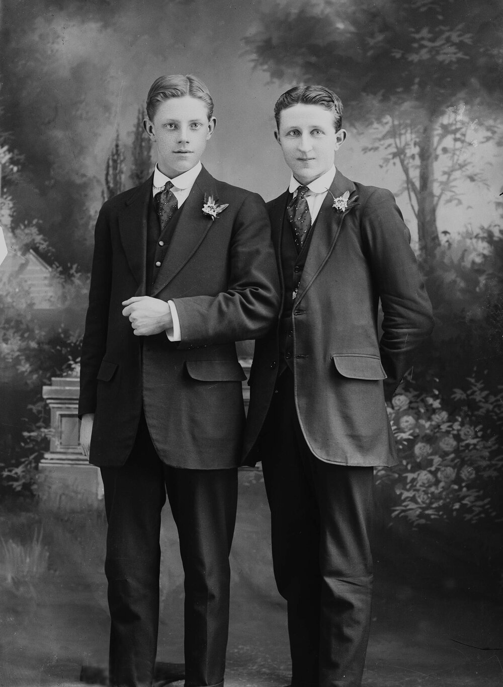 Studio full-length portraits of two young men.