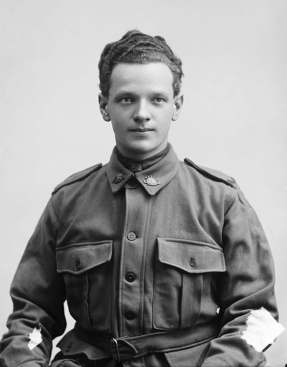 Studio portrait of a young man wearing an Australian Army uniform.