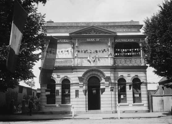 National Bank of Australasia Limited premises in Benalla adorned with flags of many nations.