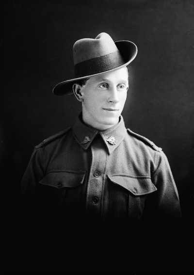 Studio portrait of a man in an Australian Army uniform.  Family name Bone.