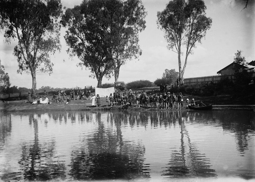 A swimming event at a river.