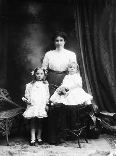 Portrait of a woman and two young girls.  Family name Bryne.
