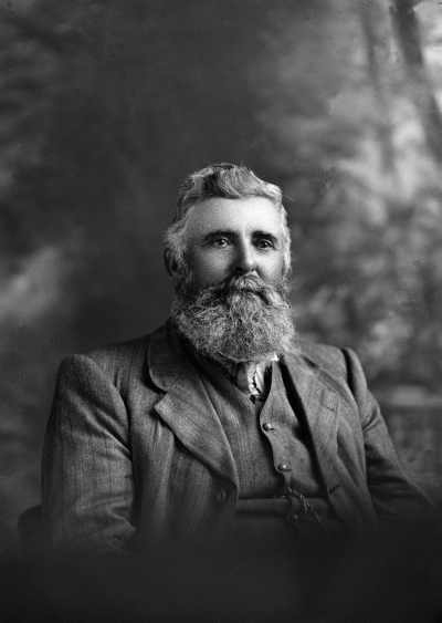 Studio portrait of Mr. Hopkins wearing a suit.