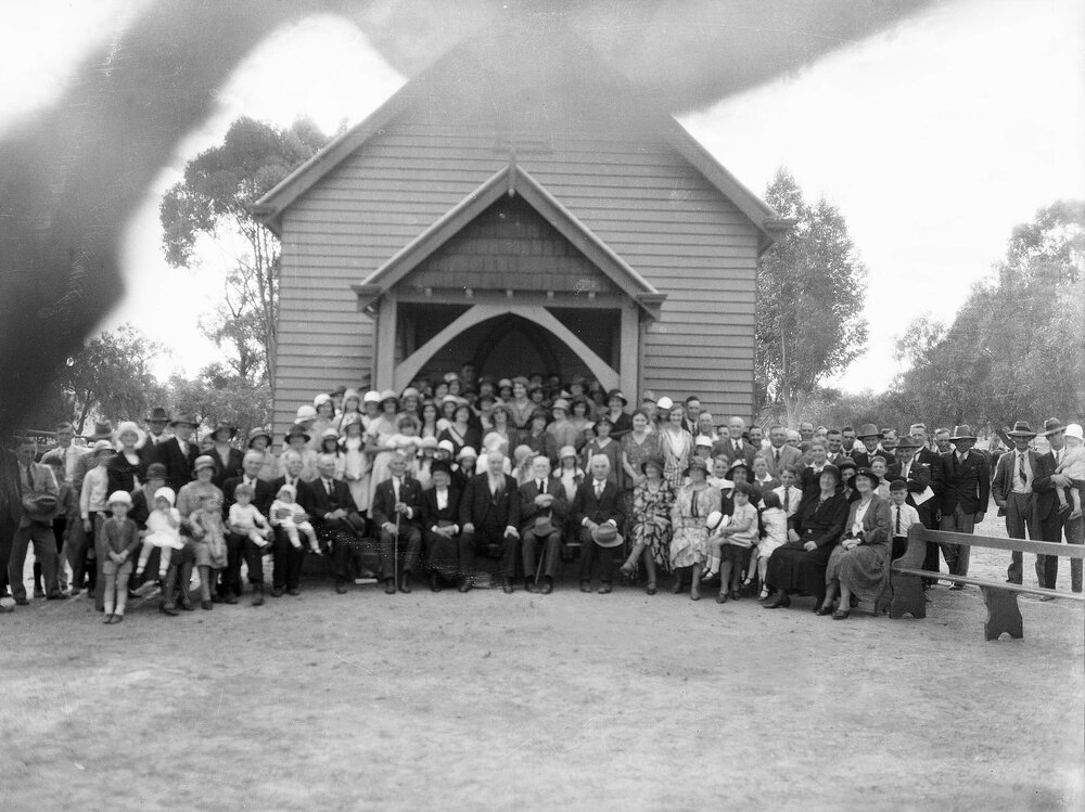 A large group posed outside a hall or church building, possibly in Benalla.