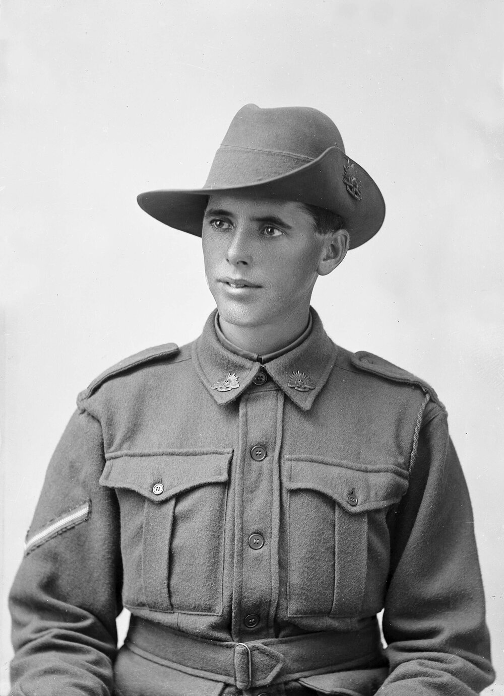 Portrait of a young man wearing an Australian Army uniform.