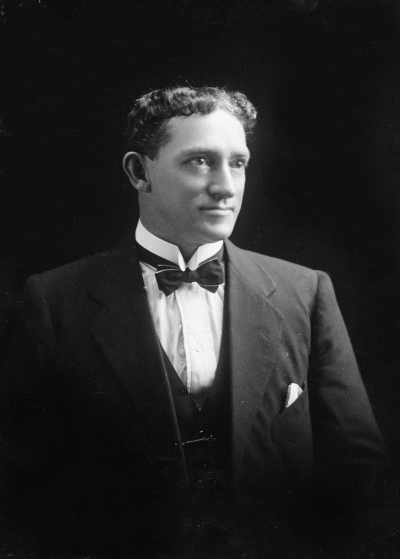Studio portrait of Mr. Doyle wearing a suit.