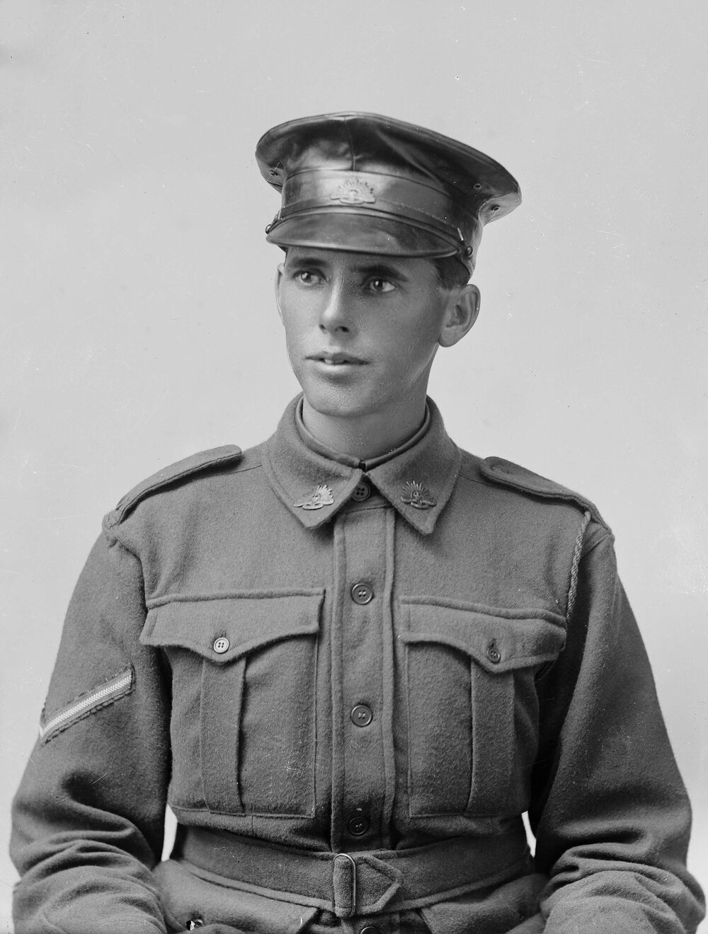 Portrait of a young man wearing an Australian Army uniform.