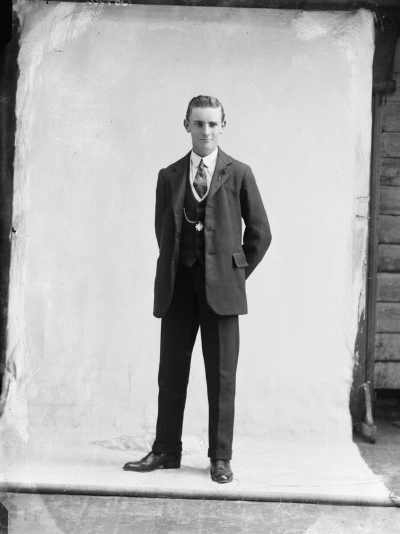 Portrait of a young man in a suit.  Family name Bond.