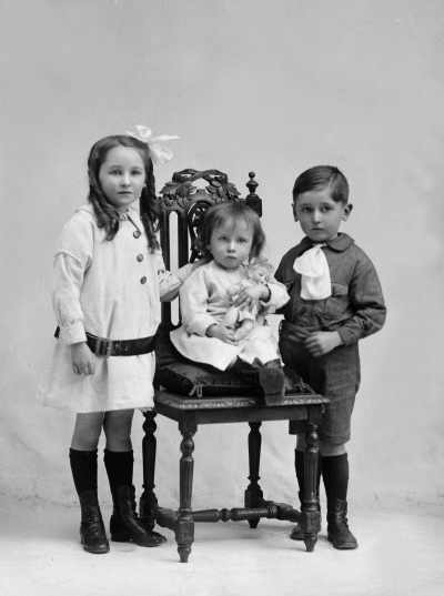 Studio portrait of three children.  Family name Mc Coy.