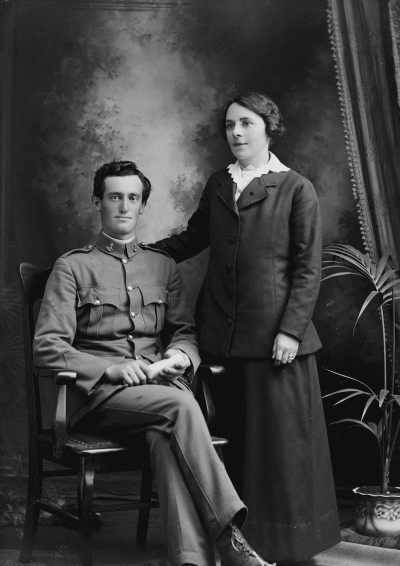 Studio portrait of a man and a woman.  Family name Farmer.