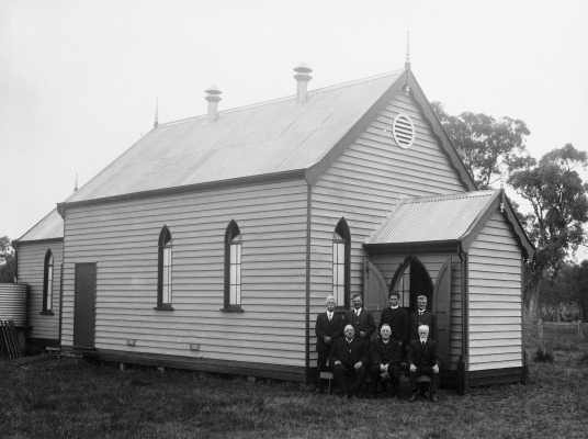 An unidentified small timber church in a rural environment.