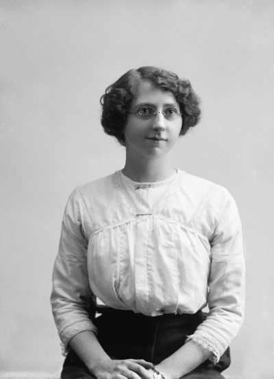 Studio portrait of  a young woman with spectacles.
