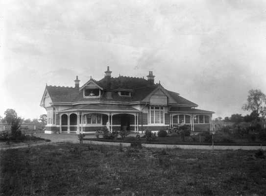 A large brick Edwardian single story home with an extensive garden.