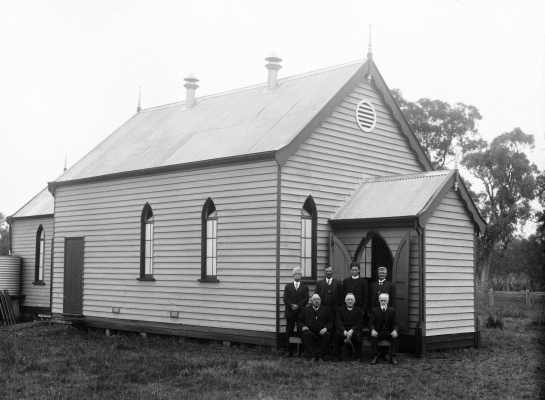 An unidentified small timber church in a rural environment.