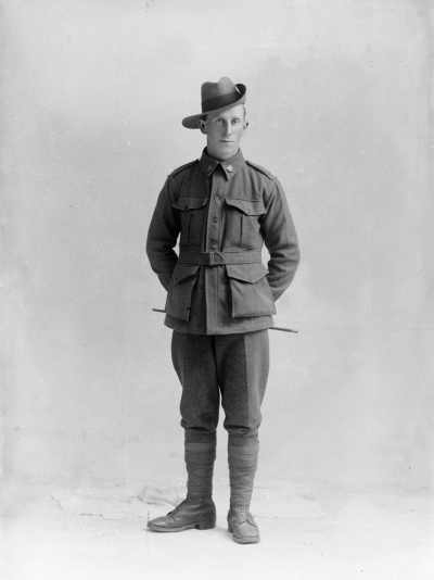 Studio portrait of a young man in an Australian Army uniform.  Family name Bone.
