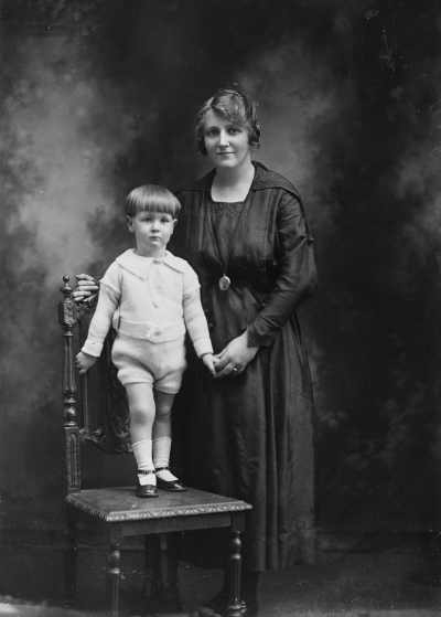 Studio portrait of a woman and a small boy.  Family name Gleeson.