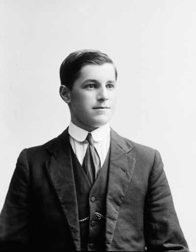 Studio portrait of a young man wearing a suit.  Family name Wedgwood or Wedgewood.