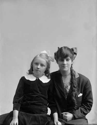 Studio portrait of a young woman and a girl.  Family name Stott.