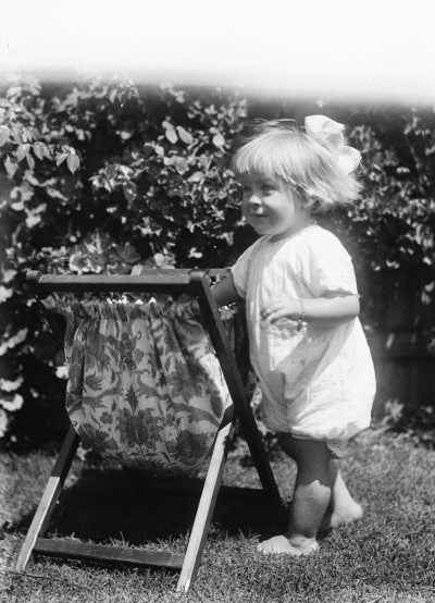 An unidentified young girl playing in an outdoor location.