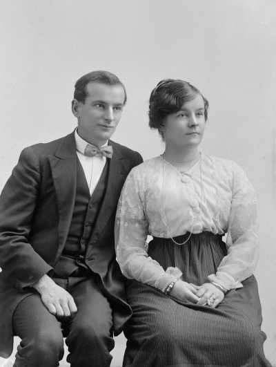 Portrait of a seated man and woman.