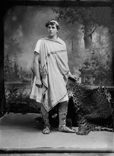 Studio portrait of a young man dressed in a Roman toga. Family name possibly Waller.