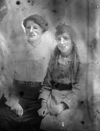 Studio portrait of a seated woman and girl -  family name McInerney.